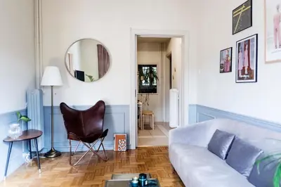 a living room with a couch and a mirror at Agora Vista Acropolis in Athens