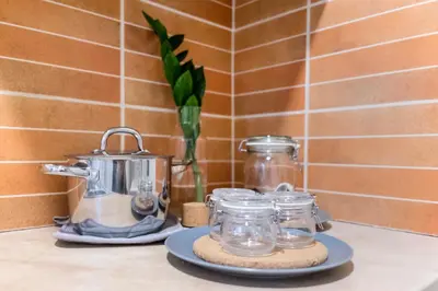 a counter top with a tea kettle and glass jars at Agora Vista Acropolis in Athens