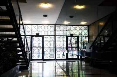 a hallway with a large glass window in a building at Athens Edition Guesthouse in Athens