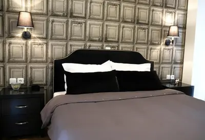a bedroom with a bed with two night stands and two lamps at Athens Edition 2.0 in Athens