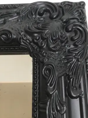 a black picture of a cross on a mirror at Athens Edition 2.0 in Athens