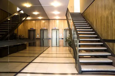 an empty hallway with stairs in a building at Athens Edition 2.0 in Athens