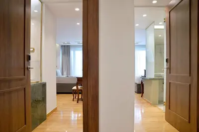 a hallway with a door leading to a room at Acropolian Spirit Boutique Hotel in Athens