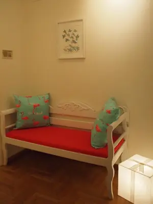 a toy bench with a red blanket and a pillow at Charming Studio Posh Quartier (Kolonaki Athens) in Athens