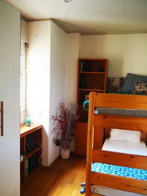 a bedroom with a bunk bed and a book shelf at Best Point To Stay in Athens
