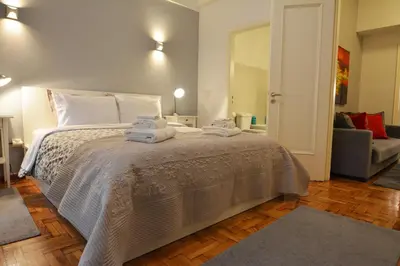 a bedroom with a bed with towels on it at Stylish apartment in Kolonaki in Athens