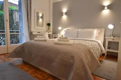 a bedroom with a bed with two towels on it at Stylish apartment in Kolonaki in Athens