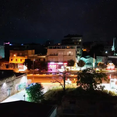 a view of a city at night with lights at Ceramus Apartments Gazi View in Athens