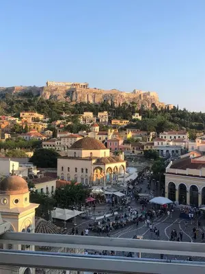 a view of a town with a mountain in the background at Stylish Syntagma apartment in Athens
