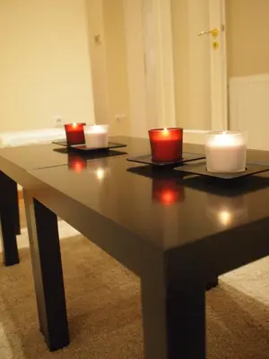 a table with two candles on top of it at Cosy Flat Posh Quartier Kolonaki in Athens
