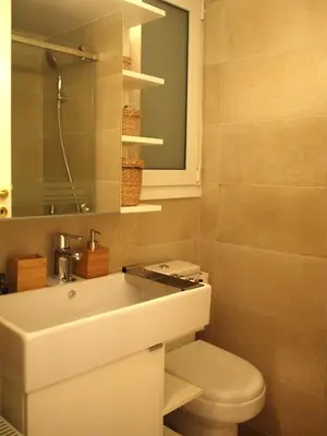 a bathroom with a white sink and a toilet at Cosy Flat Posh Quartier Kolonaki in Athens