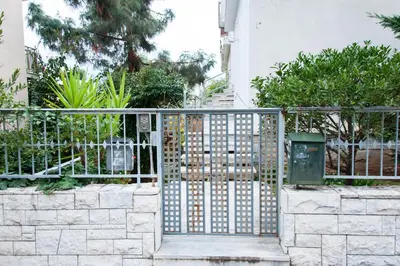 a metal gate in front of a building at Stephany Apartment in Athens