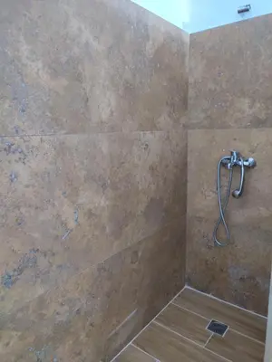 a shower with a shower head in a bathroom at Kolonaki Elegant apartment in Athens