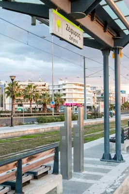 a train station with benches and a sign that reads zrupal returns at Krystal Apartment 