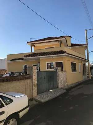 a white car parked in front of a house at Lepa Kuca in Spáta