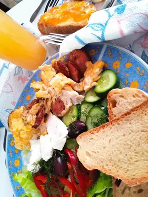 a plate of food with a salad and toast at Lepa Kuca in Spáta