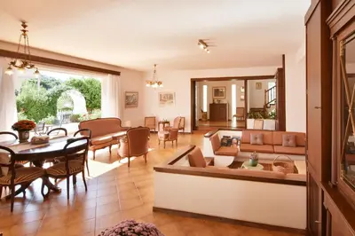 a living room with a couch and a table at Villa Noa in Anavissos