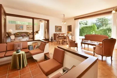 a living room with a couch and chairs at Villa Noa in Anavissos