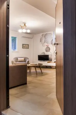 a living room with a couch and a table at Acropolis Quiet Apartment in Athens