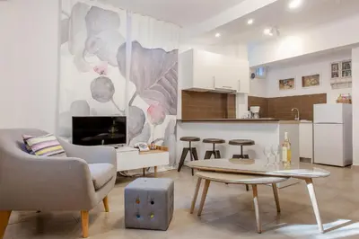 a living room with a couch and a table at Acropolis Quiet Apartment in Athens