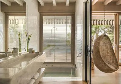 a bathroom with a large tub and a large window at Four Seasons Astir Palace Hotel Athens in Athens