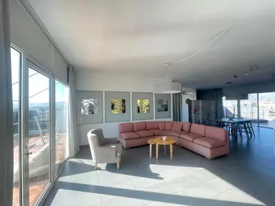a living room with a pink couch and chairs at Virgo - Loft with Spectacular View to Acropolis in Athens