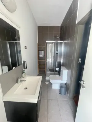a bathroom with a sink and a toilet at Virgo - Loft with Spectacular View to Acropolis in Athens