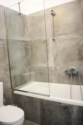 a bathroom with a shower and a toilet at Ulysses Apartments Acropolis in Athens