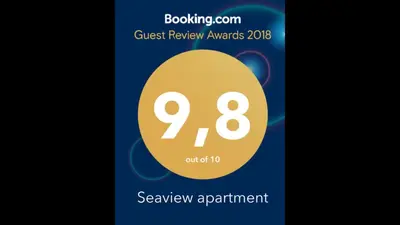 a poster for the guest review awards with the number eight at Seaview apartment in Piraeus