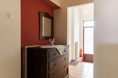 a bathroom with a dresser and a mirror on a wall at House with yard Subway 5min walk in Athens