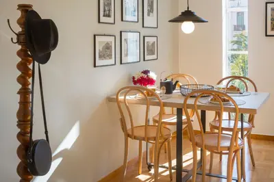 a dining room with a table and chairs at Auntie’s Home in Athens
