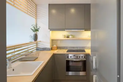 a kitchen with a sink and a stove at Auntie’s Home in Athens