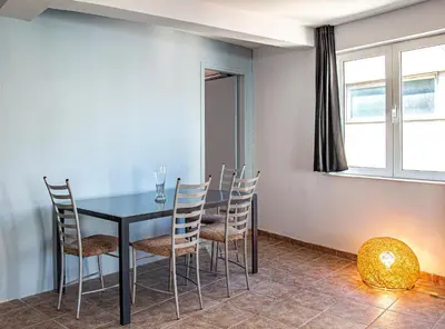 a dining room with a black table and chairs at Loft in Athens
