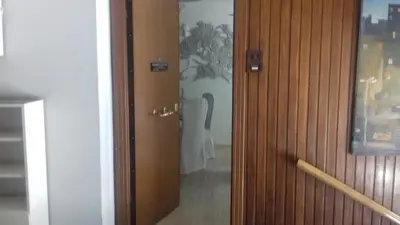 a door leading into a room with a chair at The Best Spot in The Center in Athens