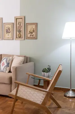 a living room with a coffee table and a couch at Meros - Athenian Residencies in Athens