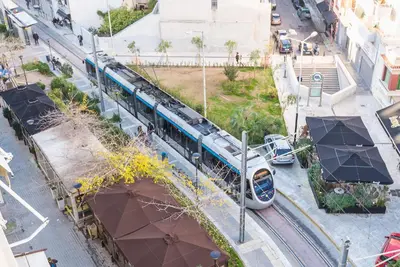 a train is on the tracks in a city at Athens View in Athens
