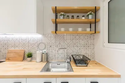 a kitchen with a sink and a counter top at Sleek Flat in Central Syntagma by UPSTREET in Athens
