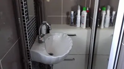 a bathroom with a white toilet in a stall at For Harbor Travelers in Piraeus