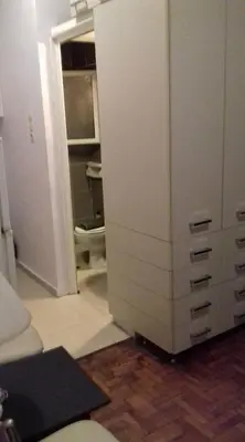 a room with a closet with a dresser at For Harbor Travelers in Piraeus