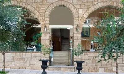 an entrance to a building with two arches at Elizabeth Hotel in Athens