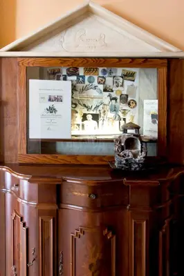 a wooden cabinet with a mirror on top of it at Elizabeth Hotel in Athens