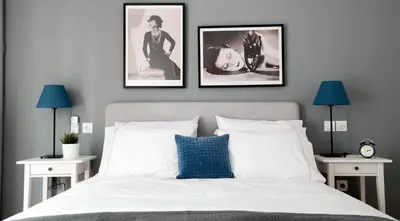 a bedroom with a bed with three pictures on the wall at Modern Downtown Flat near the Acropolis by UPSTREET in Athens