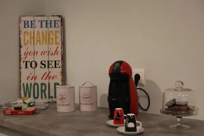 a counter with a red blender and other items on it at Ports Crossroad B in Piraeus