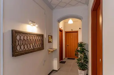 a hallway with a door and a potted plant at Ports Crossroad B in Piraeus