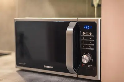 a microwave oven sitting on top of a counter at Stylish Luxury Apartment near Acropolis at Neos Kosmos metro station in Athens