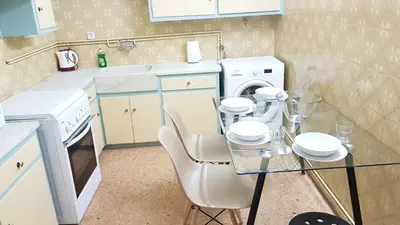 a kitchen with a glass table and a washing machine at Menta errathens Apartment - Athens Center, 5 BD, 2 BATH in Athens