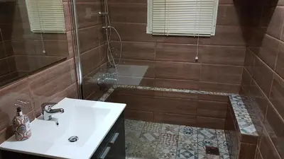 a bathroom with a sink and a shower at Menta errathens Apartment - Athens Center, 5 BD, 2 BATH in Athens