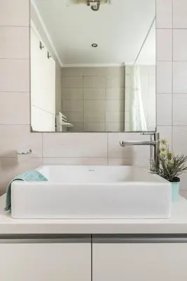 a white bathroom with a sink and a mirror at Skyview Penthouse / Central Athens in Athens