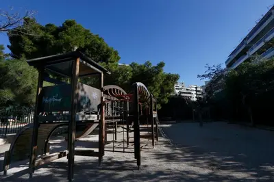a playground with a slide in a park at Charming City Centre Flat Kolonaki in Athens
