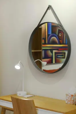 a mirror sitting on top of a wooden desk at Charming City Centre Flat Kolonaki in Athens